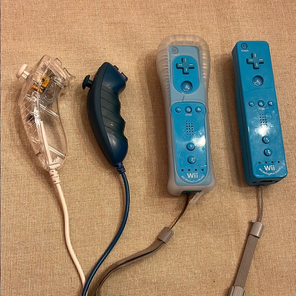 Blue and Gray Nintendo Controllers with Nunchuck Attachments